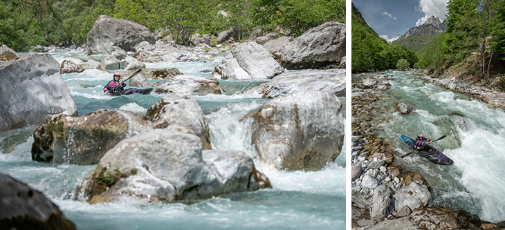 Kayaker wearing a helmet paddling through a rocky turquoise river with forested cliffs.